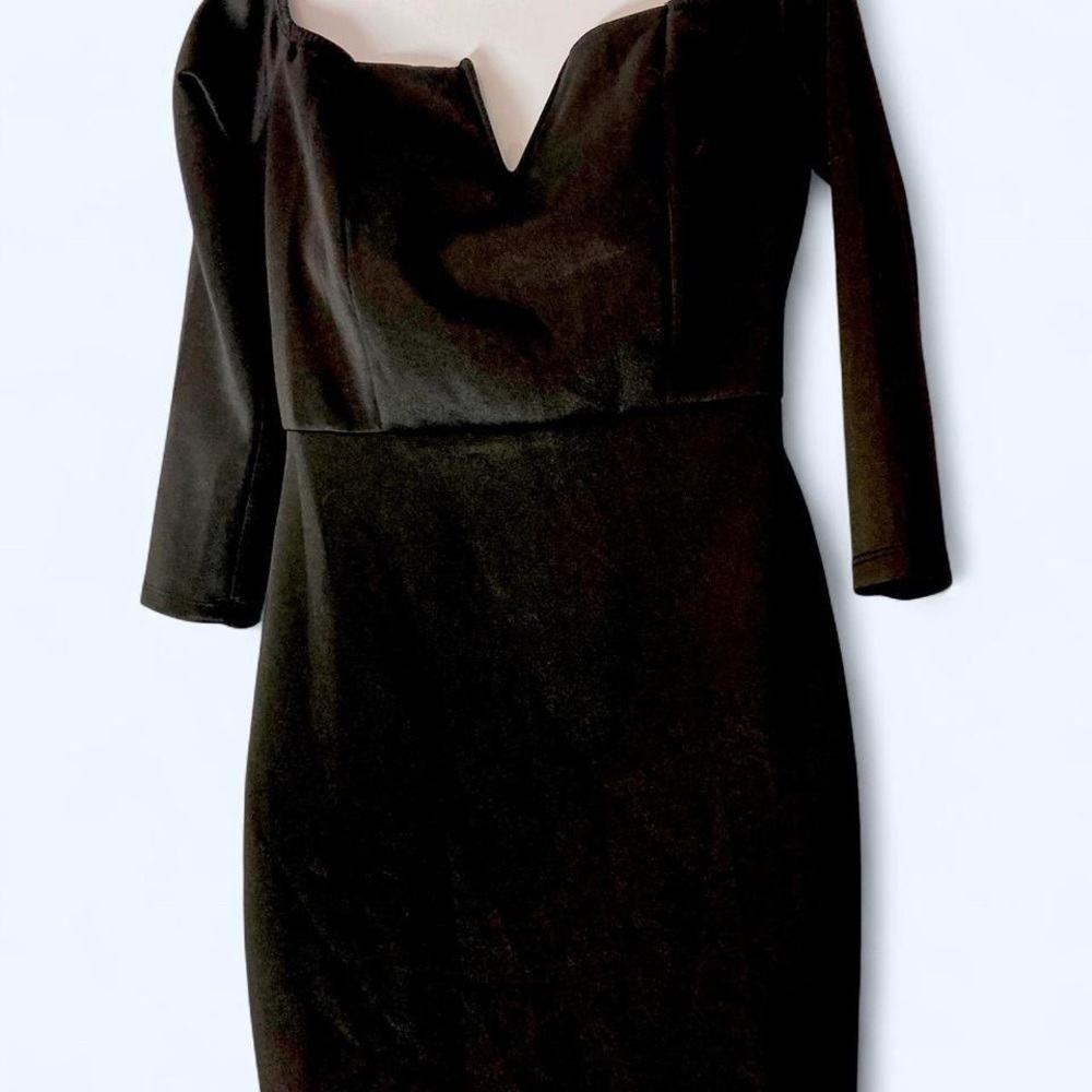 Black midi dress with ruffle hem and 3/4 sleeves. Size: M